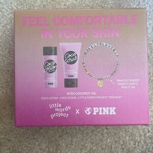 NIB pink feel comfortable in your skin lotion and body wash gift set​​​​​​​